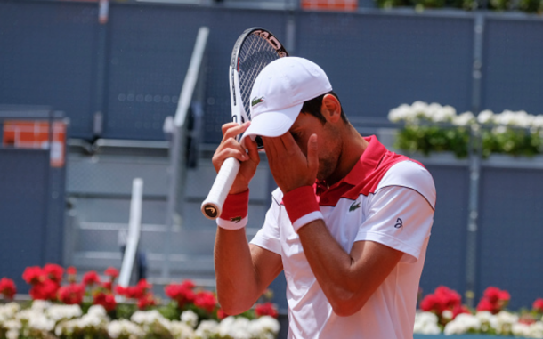 A frustrated Djokovic reacts to losing to Kyle Edmund in Madrid (NurPhoto/Getty Images)