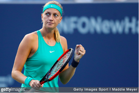 Kvitova celebrates after defeating Radwanska