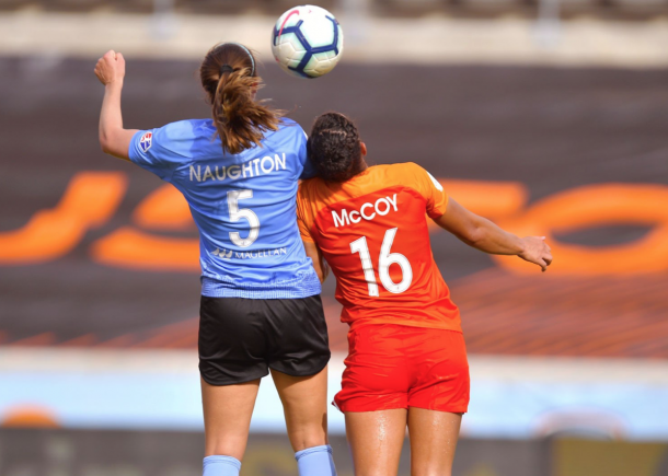 Chicago Red Star Katie Naughton (5) and Houston Dash Kayla McCoy (16) battle for a header. Photo: twitter.com/HoustonDash 