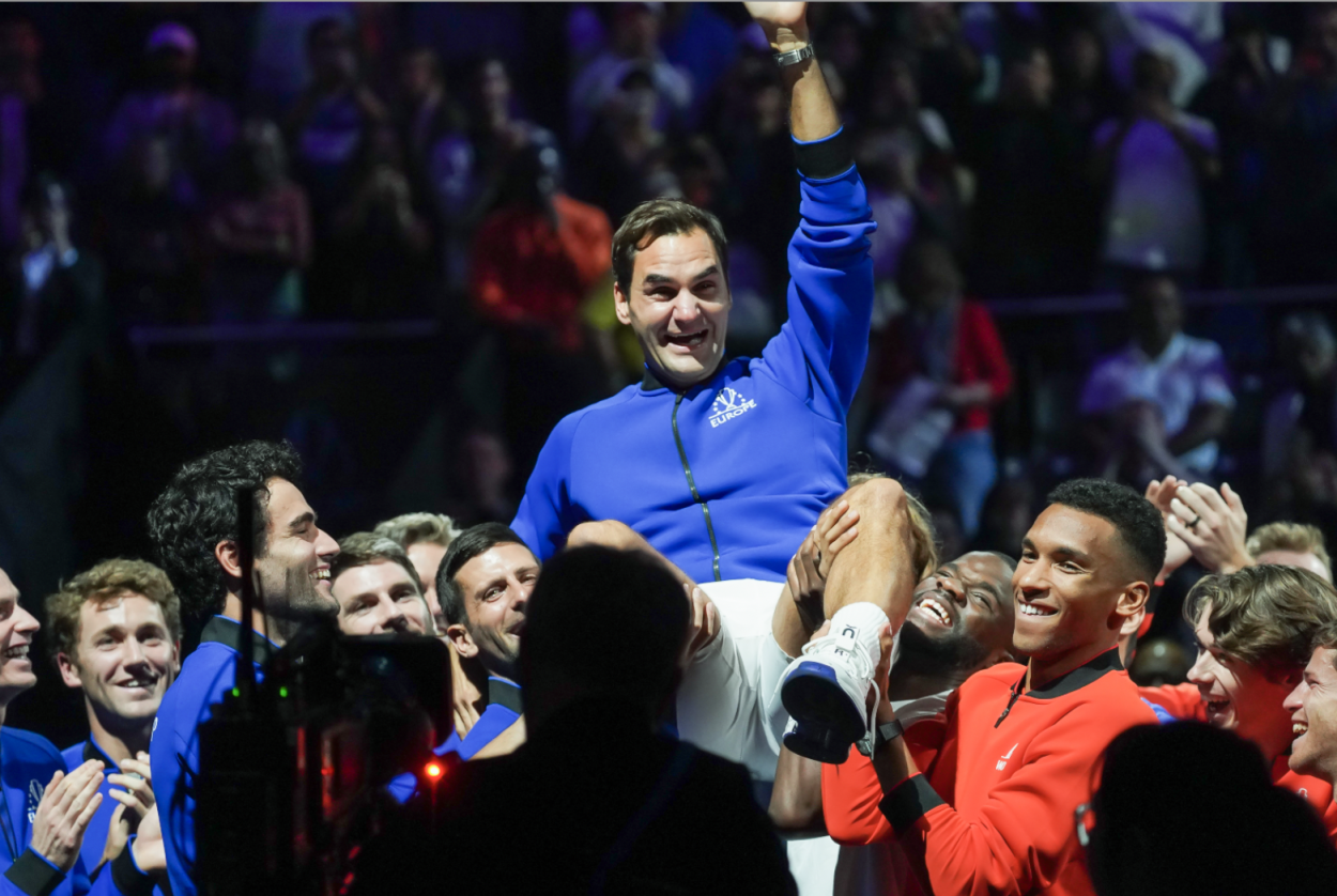 Members of Team World and Team Europe lift up Federer during his farewell ceremony (Alexandra-Larisa Fechete/VAVEL USA)