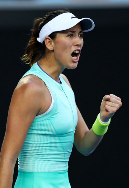 Garbiñe Muguruza fist pumping her way through the quarterfinals  | Photo: Cameron Spencer / Getty Images 