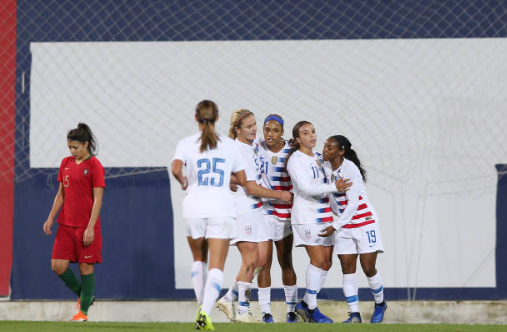 Jessica McDonald (center) is congratulated after scoring her first career goal for the United States. | Photo: Gualter Fatia - Getty Images