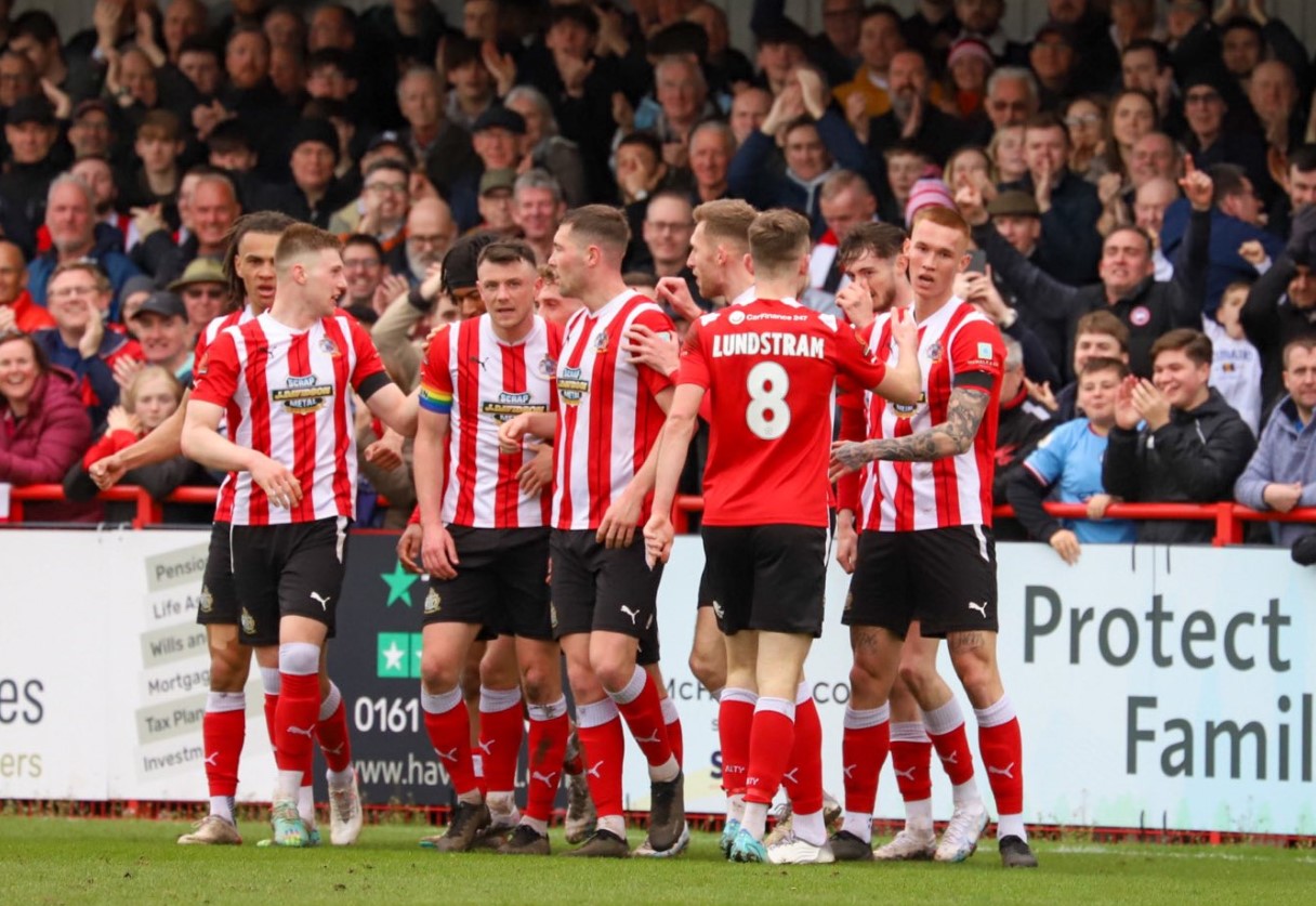 Altrincham players celebrate their opener (Photo: Jonathan Moore/Altrincham FC)