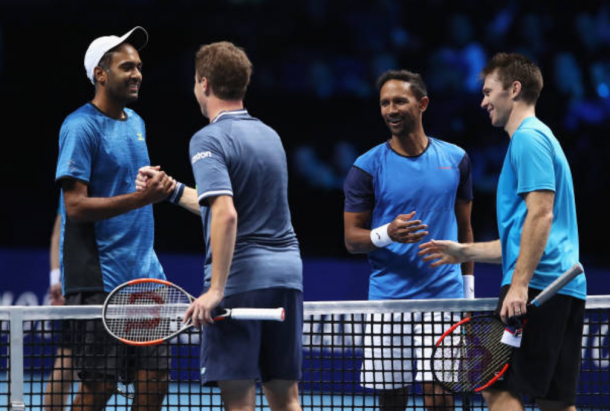 Raven Klaasen and Rajeev Ram all smiles at the net shaking hands with Henri Kontinen and John Peers (Photo: Julian Finney/Getty Images