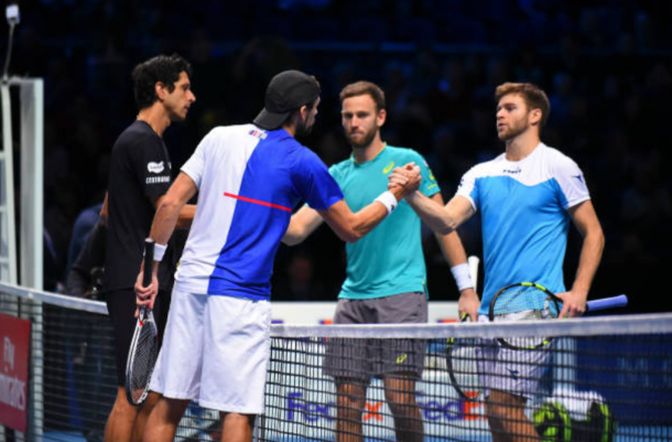 Ryan Harrison and Michael Venus congratulate Lukasz Kubot and Marcelo Melo (Photo: Julian Finney/Getty Images)