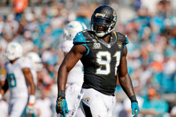 Defensive end Chris Clemons looks on in a game against the Miami Dolphins. Image via Rob Foldy/Getty Images