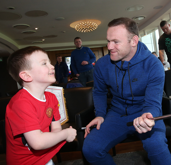 Wayne Rooney takes a selfie at a Manchester United Foundation event | Photo: John Peters/Manchester United