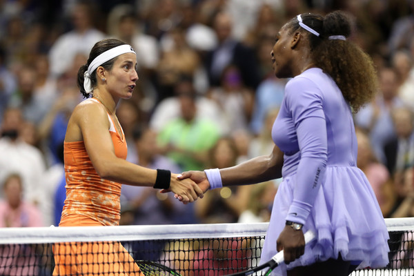 Williams and Sevastova meet at the net after the match | Photo: Matthew Stockman/Getty Images North America