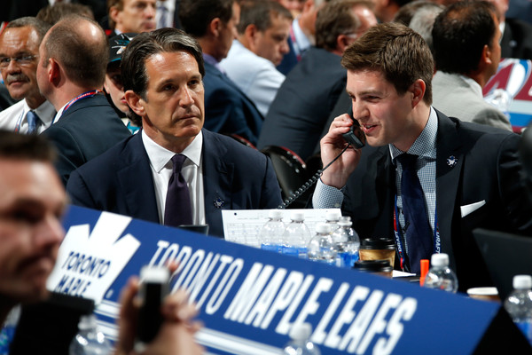 Shanahan (left) and assistant GM Kyle Dubas (on the phone) at the 2015 Entry Draft, where they took Mitch Marner 4th overall. Photo: Bruce Bennett/Getty Images