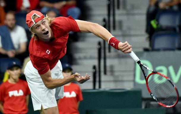 Shapovalov hits a serve during his Davis Cup debut. Photo: Lafotoz