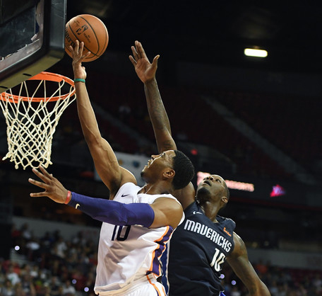 Shaquille Harrison #10 of the Phoenix Suns drives to the basket against Dorian Finney-Smith #10 of the Dallas Mavericks. |Ethan Miller/Getty Images North America|