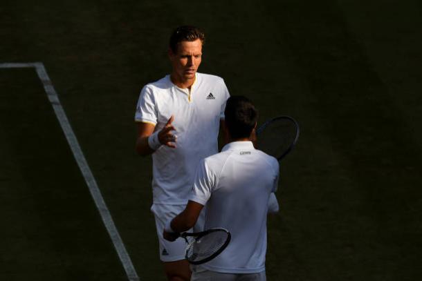 Tomas Berdych and Novak Djokovic meet at the end of the match (Getty/Shaun Botterill)