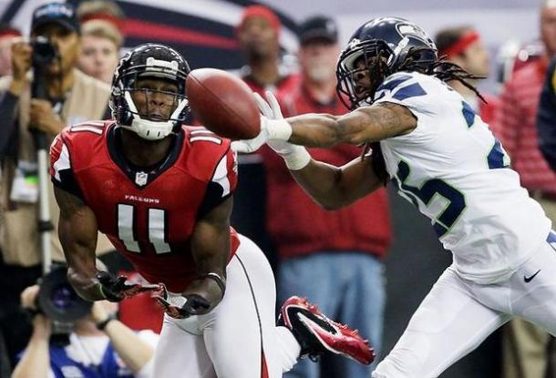 Richard Sherman defends a pass to Julio Jones during the NFC Divisional Round in January 2013 | Source: AP Photo