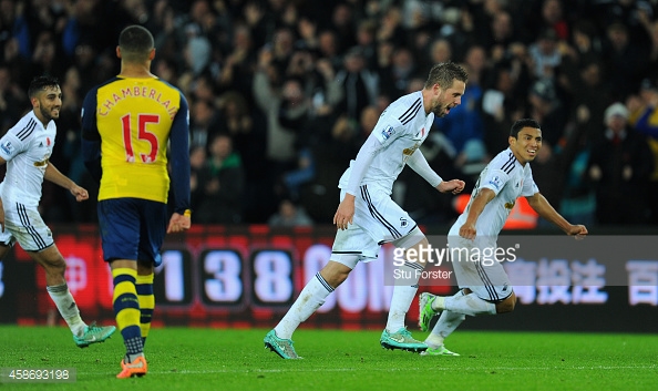 Gylfi Sigurdsson celebrating his goal in Swansea's 2-1 win at home to Arsenal back in 2014. (Image by Getty Images/Stu Forster)