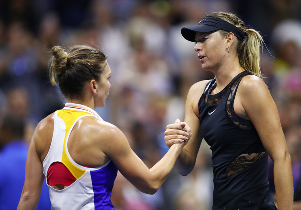 Maria Sharapova (R) and Simona Halep shake hands after their first-round battle at the 2017 U.S. Open. | Photo: Clive Brunskill/Getty Images