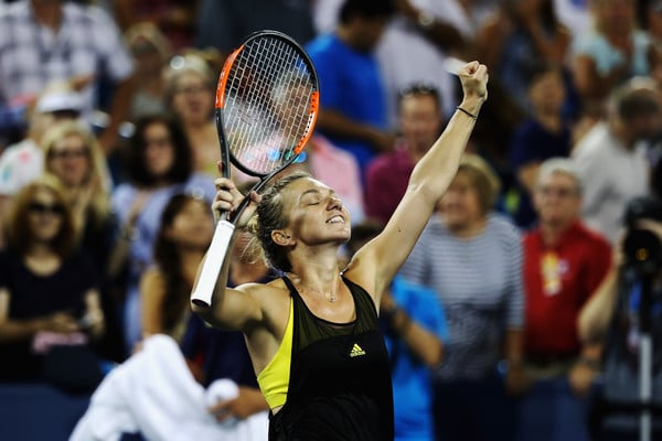 Simona Halep celebrates her first-ever win over Johanna Konta in a WTA match | Photo: Rob Carr/Getty Images North America