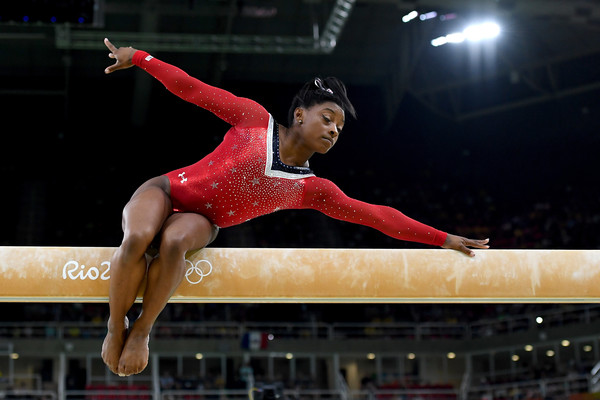 Simone Biles of the United States competes on the balance beam during the individual event finals at the Olympics/Photo: Laurence Griffiths/Getty Images