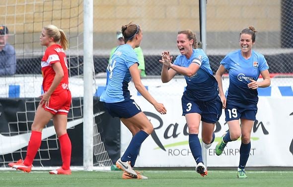 Christie Rampone #3 of Sky Blue FC celebrates her goal during the second half with teammates Sarah Killion #14 and Kelley O'Hara #19 against the Western New York Flash at Sahlen's Stadium on July 19, 2015 in Rochester, New York. The Sky Blue FC and the Western New York Flash played to a 0-0 draw. (Photo by Rich Barnes/Getty Images