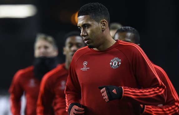 Chris Smalling warms up ahead of a Champions League game