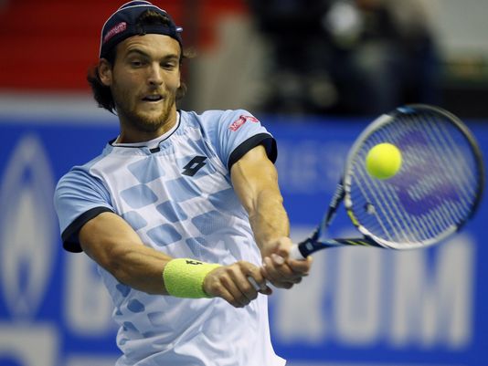 Joao Sousa hits a backhand during the 2015 St. Petersburg final. Photo: Dimitry Levetsky/AP