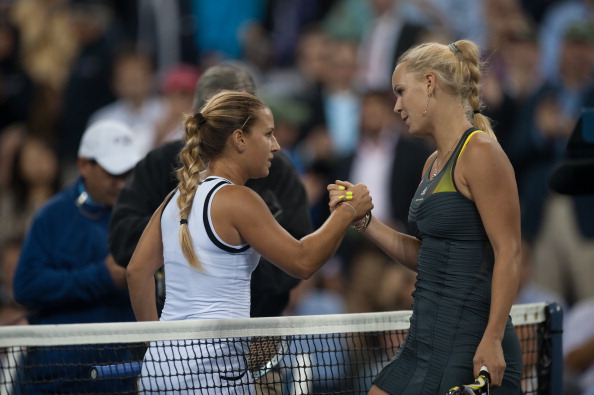 Dominika Cibulkova and Caroline Wozniacki after their match at the US Open in 2010 (SportsChrome/Rob Tringai)
