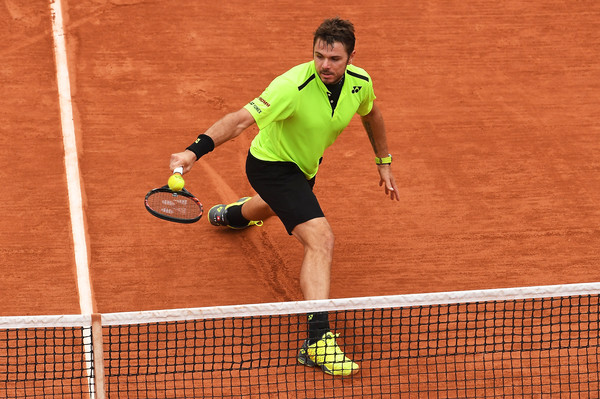 Wawrinka strikes a ball in 2016 French Open action. Photo: Dennis Grombkowski/Getty Images