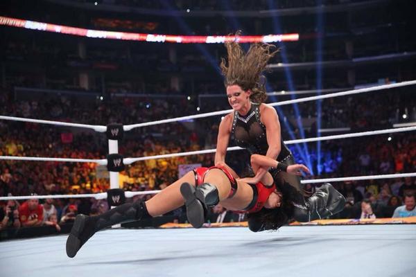 Stephanie McMahon hitting the pedigree on Brie Bella at SummerSlam (image: twitter)