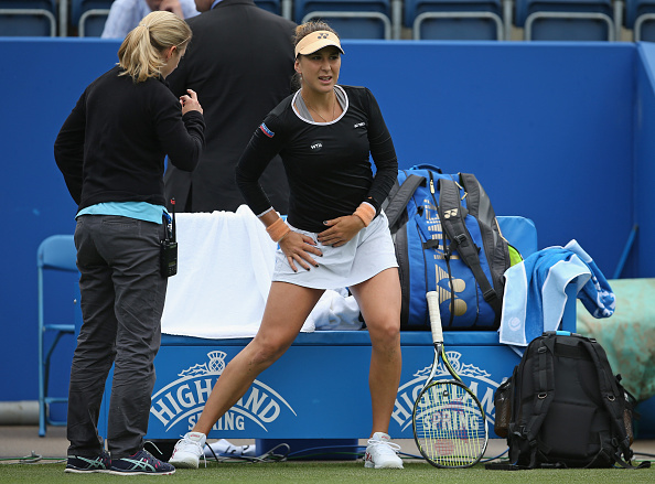 Bencic receives treatment from a physio before retiring against Irina-Camelia Begu in Birmingham (Getty/Steve Bardens)