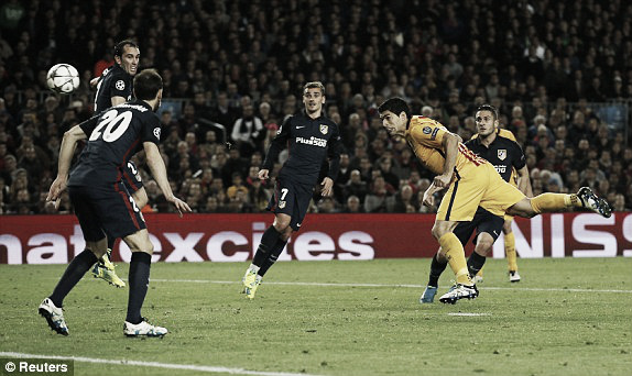 Above: Luis Suarez scores a brace in Barcelona's 2-1 win over Atletico Madrid in the first-leg of their Champions League quarter-final | Reuters 