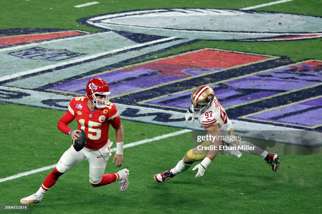  Patrick Mahomes #15 of the Kansas City Chiefs looks to pass in the fourth quarter against Nick Bosa #97 of the San Francisco 49ers during Super Bowl LVIII at Allegiant Stadium on February 11, 2024 in Las Vegas, Nevada. (Photo by Ethan Miller/Getty Images)