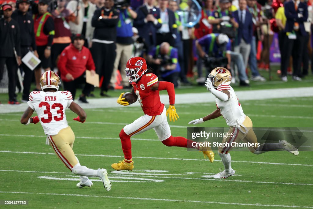Rashee Rice #4 of the Kansas City Chiefs runs the ball against Logan Ryan #33 of the San Francisco 49ers in overtime during <strong><a  data-cke-saved-href='https://www.vavel.com/en-us/nfl/2024/01/14/1168659-kansas-city-chiefs-26-7-miami-dolphins-ice-cold-chiefs-pick-up-the-win.html' href='https://www.vavel.com/en-us/nfl/2024/01/14/1168659-kansas-city-chiefs-26-7-miami-dolphins-ice-cold-chiefs-pick-up-the-win.html'>Super Bowl</a></strong> LVIII at Allegiant Stadium on February 11, 2024 in Las Vegas, Nevada. (Photo by Steph Chambers/Getty Images)