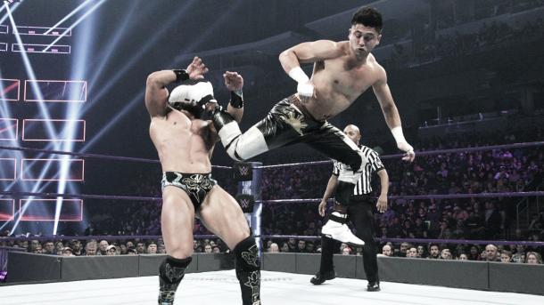 Perkins hits a spinning heel kick. Photo- WWE.com