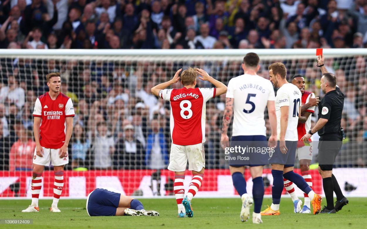 LONDON, ENGLAND - MAY 12: Rob Holding of Arsenal is shown a red card following a foul on Heung-Min Son of Tottenham Hotspur by Match Referee, during the Premier League match between Tottenham Hotspur and Arsenal at Tottenham Hotspur Stadium on May 12, 2022 in London, England. (Photo by Clive Rose/Getty Images)