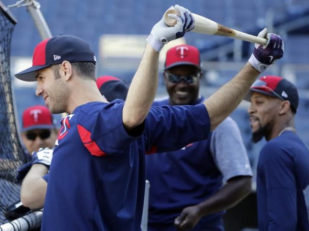 Joe Mauer (l.) works out on Monday in preparation for the AL Wild Card Game/Photo: Frank Franklin II/Associated Press