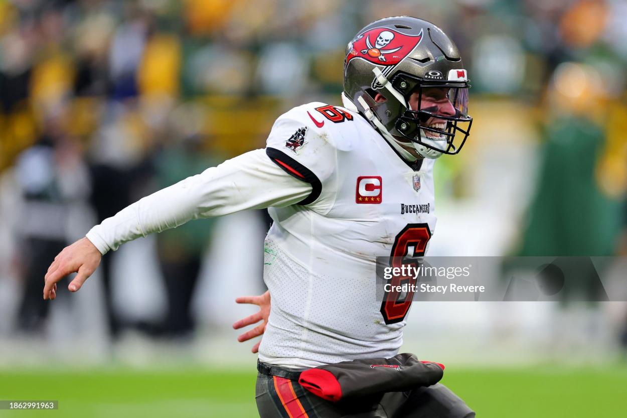 Baker Mayfield #6 of the <strong><a  data-cke-saved-href='https://www.vavel.com/en-us/nfl/2023/08/31/1154726-can-anyone-stop-the-philadelphia-eagles-2023-nfc-east-preview.html' href='https://www.vavel.com/en-us/nfl/2023/08/31/1154726-can-anyone-stop-the-philadelphia-eagles-2023-nfc-east-preview.html'>Tampa Bay</a></strong> Buccaneers reacts after throwing a touchdown during the fourth quarter against the <strong><a  data-cke-saved-href='https://www.vavel.com/en-us/nfl/2023/11/23/1163974-nfl-detroit-lions-22-29-green-bay-packers-report.html' href='https://www.vavel.com/en-us/nfl/2023/11/23/1163974-nfl-detroit-lions-22-29-green-bay-packers-report.html'>Green Bay</a></strong> Packers at <strong><a  data-cke-saved-href='https://www.vavel.com/en-us/nfl/2023/10/27/1160703-vikings-vs-packers-preview-fight-for-the-national-league-north.html' href='https://www.vavel.com/en-us/nfl/2023/10/27/1160703-vikings-vs-packers-preview-fight-for-the-national-league-north.html'>Lambeau Field</a></strong> on December 17, 2023 in <strong><a  data-cke-saved-href='https://www.vavel.com/en-us/nfl/2023/11/23/1163974-nfl-detroit-lions-22-29-green-bay-packers-report.html' href='https://www.vavel.com/en-us/nfl/2023/11/23/1163974-nfl-detroit-lions-22-29-green-bay-packers-report.html'>Green Bay</a></strong>, Wisconsin. (Photo by Stacy Revere/Getty Images)