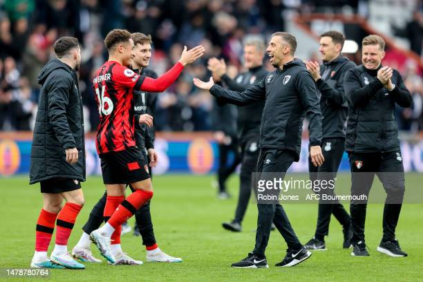 Tavernier celebrates the win with manager Gary O'Neil - Photo by Robin Jones - AFC Bournemouth/AFC Bournemouth via Getty Images)