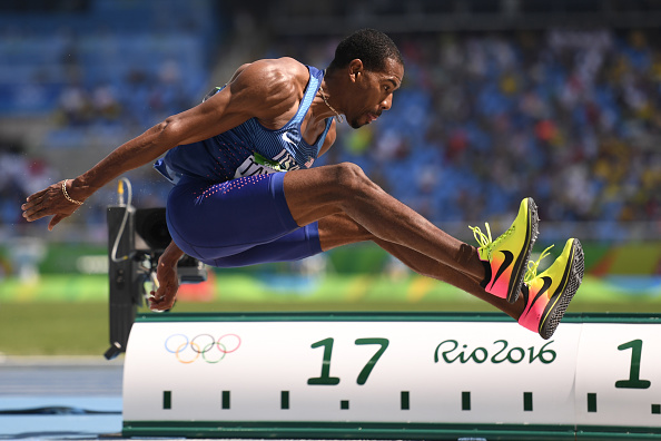 Christian Taylor jumps during the final of the Triple Jump (AFP/Fabrice Coffrini)