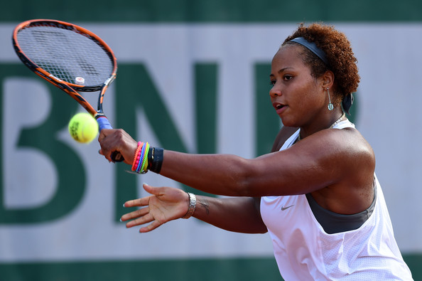 Taylor Townsend slices a backhand in her 2014 French Open upset over Cornet. Photo: Matthias Hangst/Getty Images