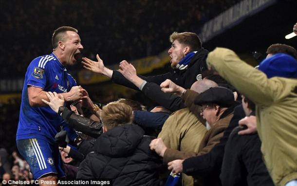 Terry celebrates with the fans after his dramatic equaliser.