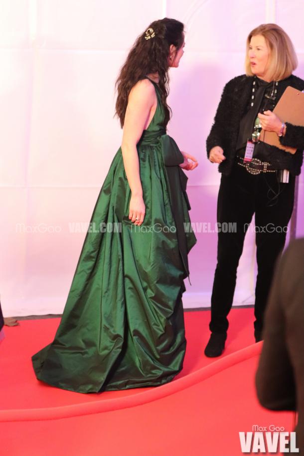 Gorgeous in Green: Tessa Virtue looked stunning in an emerald green gown by Spanish designer Yolancris, and wore a pink ostrich feather jacket by Fox the Label when she originally entered the red carpet.