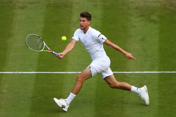 Thiem plays a forehand volley during his second round loss at Wimbledon. Photo: Julian Finney/Getty Images