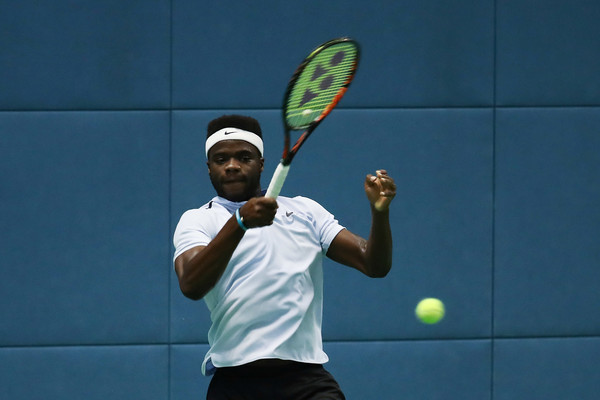 Photo Source: Lintao Zhang/Getty Images AsiaPac-Frances Tiafoe returns a ball in his match against Sam Querrey.