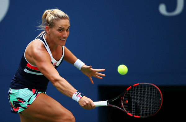 Timea Babos hits a backhand slice during her second-round match against Maria Sharapova at the 2017 U.S. Open. | Photo: Clive Brunskill/Getty Images