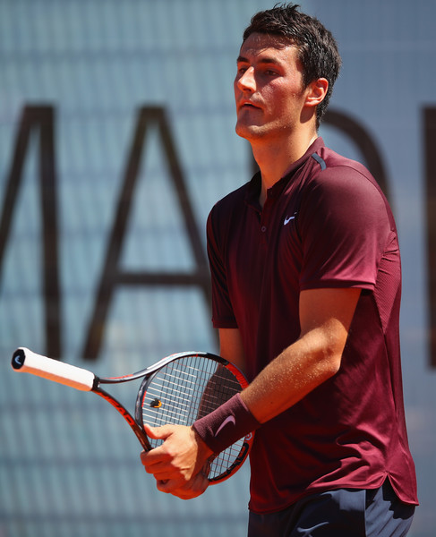 Bernard Tomic awaits a serve from Fabio Fognini in Madrid while holding his racquet reversed. Photo: Clive Brunskill/Getty Images 