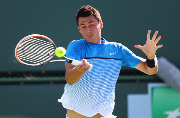 Bernard Tomic hits a forehand during his second round win. Photo: Julian Finney/Getty Images