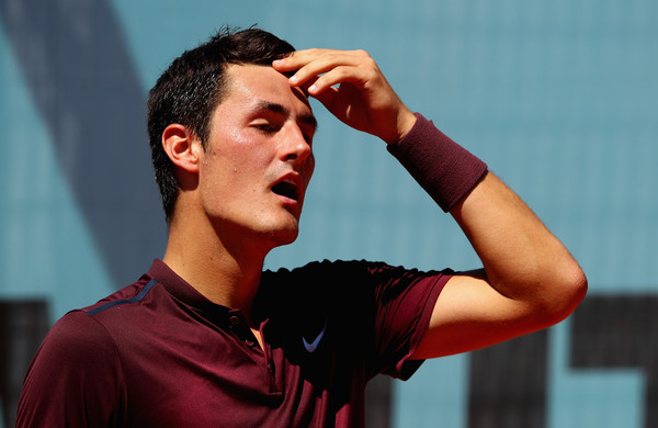 Bernard Tomic shows some dejection during his first round loss in Madrid. Photo: Clive Brunskill/Getty Images