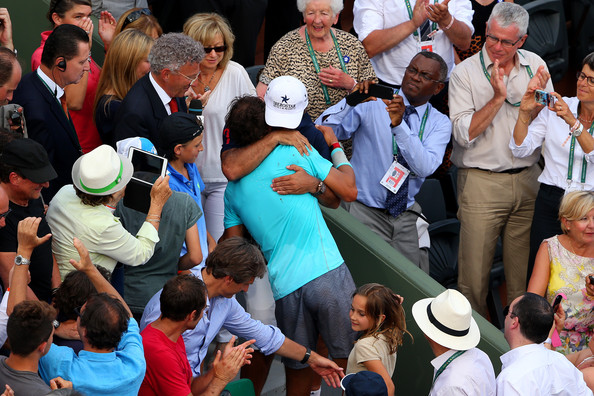 Toni and Rafael Nadal (in blue) embrace after Rafael's 2014 French Open title. Photo: Clive Brunskill/Getty Images