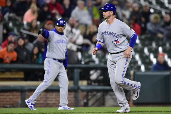 Justin Smoak being waved home after a throwing error by right fielder Anthony Santander saw the ball go into one of the dugouts. This would be Toronto’s first run of the night. | Photo: Patrick McDermott/Getty Images