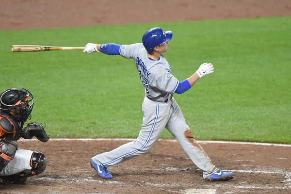 Darwin Barney hits a two-run home run in the eighth inning against the Orioles. | Photo: Mitchell Layton/Getty Images