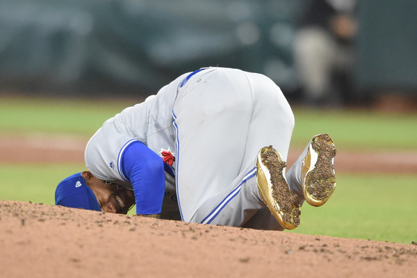 Marcus Stroman falls to the ground in agony after being hit by a line drive by Mark Trumbo in the second inning. | Photo: Mitchell Layton/Getty Images